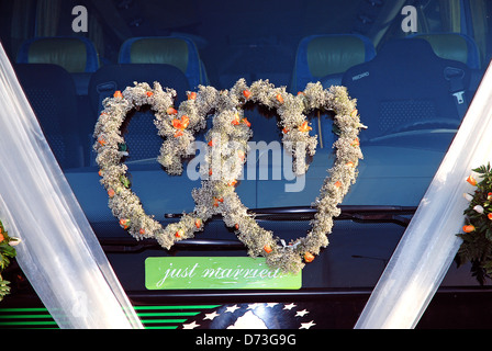 Car decoration for a wedding. Decorations on the car of the