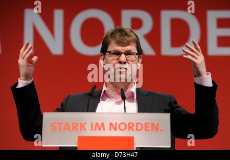 The chairman of Schleswig-Holstein's SPD,  Ralf Stegner (SPD), speaks during the SPD party conference in Buedelsdrof, Germany, 28 April 2013. Amongst other issues the conference was concered with the lists of candidates to run on the SPD's party ticket on state level for the forthcoming Bundestag parliamentary election in Autumn 2013. Photo:  Carsten Rehder Stock Photo