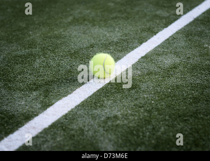 Tennis ball on a line. Stock Photo
