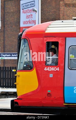Train driver of Southwest trains sitting in his cab waiting to leave Clapham Junction Station Stock Photo