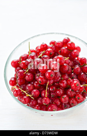 Bowl of red currant on light background, selective focus Stock Photo