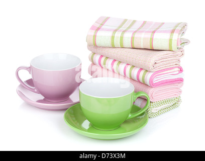 Two coffee cups and kitchen towels. Isolated on white background Stock Photo