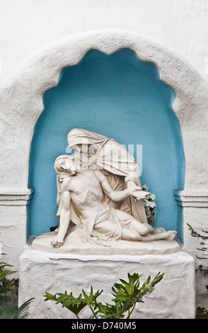 Pieta statue in the garden of the Mission Basilica San Diego de Alcala, the first Mission in California. Stock Photo