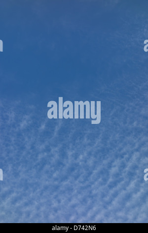 Cirrus clouds, mare's tail in blue sky. Stock Photo