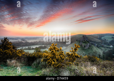 A frosty April sunrise overlooking the ruins of Corfe Castle on the Isle of Purpeck in Dorset Stock Photo