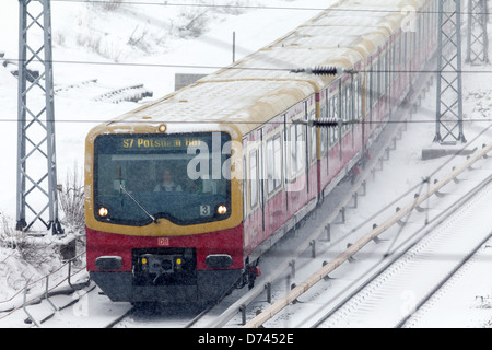 Berlin, Germany, S-train and snowy tracks in Berlin-Friedrichshain Stock Photo
