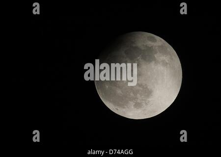 A partial lunar eclipse is visible above London from Primrose Hill, on ...