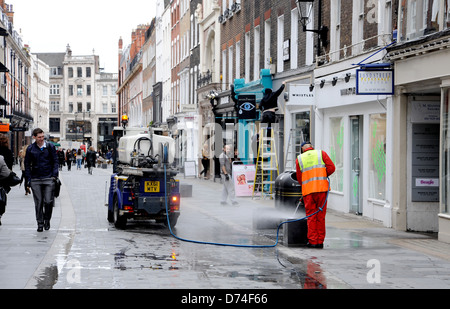 Street cleaner at work just off Oxford Street London W1 UK Stock Photo