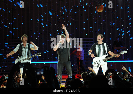 Joe Don Rooney,Gary LeVox,Jay DeMarcus of Rascal Flatts performs at the Cruzan Amphitheater West Palm Beach, Florida - 20.08.11 Stock Photo