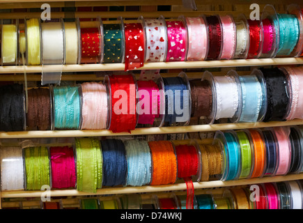 Reels of ribbon for sale at Bath market, Guildhall Market, Bath, Somerset UK in April Stock Photo