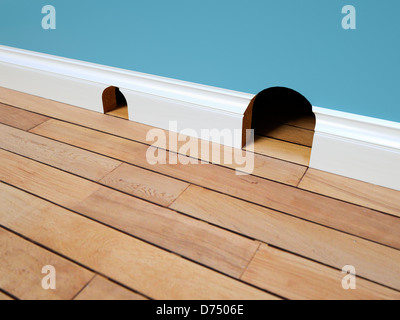 Two mouse holes - property real estate concept / trading up / up sizing / down sizing concept Stock Photo