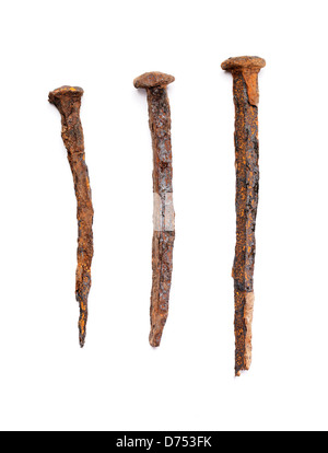 Old handforged rusty nails isolated on white with natural shadows. Stock Photo