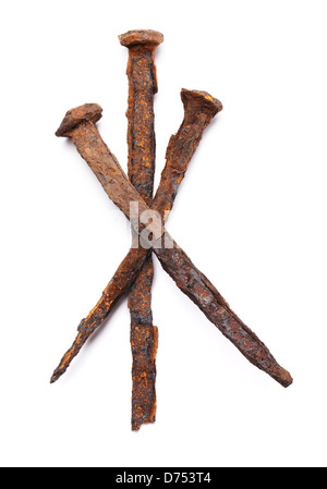 Old handforged rusty nails isolated on white with natural shadows. Stock Photo