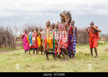 Maasai Villagers singing and dancing Stock Photo