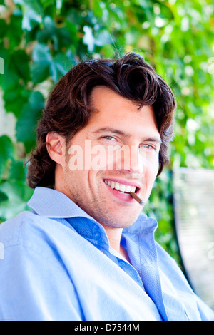 Man smoking cigarillo. Stock Photo