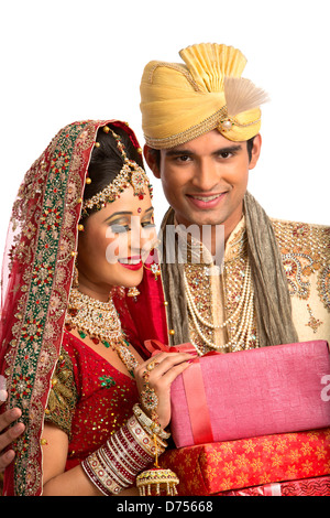 Indian newlywed couple in traditional wedding dress Stock Photo - Alamy