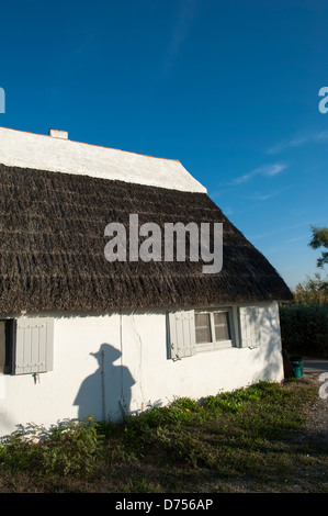 Roof of a typical guardian house in the Camargue with cowboy shadow Stock Photo