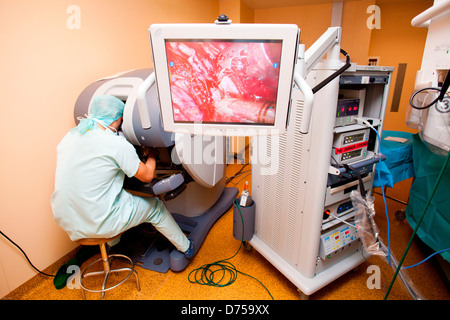 Prostatectomy performed by telesurgery robot Da Vinci which four articulated arms camera are controlled distance by surgeon Stock Photo
