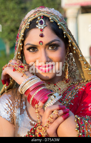 Beautiful Indian bride in traditional wedding dress and posing Stock Photo