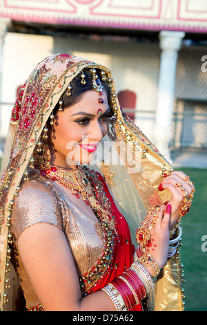 Beautiful Indian bride in traditional wedding dress and posing Stock Photo