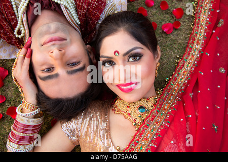 indian bride and groom in traditional wedding dress and posing d75aag