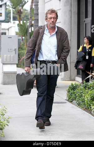 Hugh Laurie carrying his guitar as he arrives at LAX airport on a flight from London Los Angeles, California - 20.07.11 Stock Photo