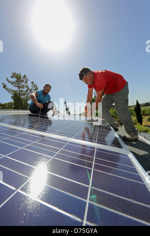 Torre Alfina, Italy, installing a solar power system on the roof of a detached house Stock Photo