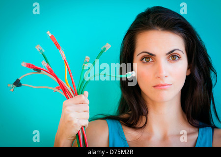 woman holding ethernet cables. Stock Photo