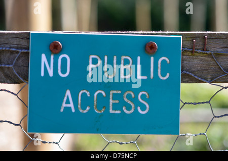 No Public access sign on chicken wire gate Stock Photo