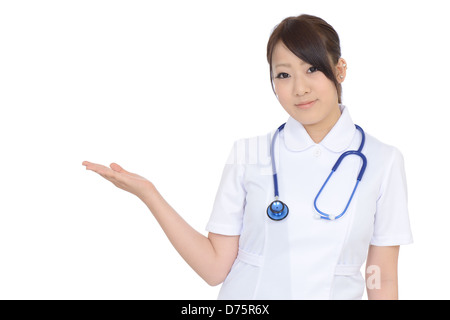 Young asian female nurse hand showing blank sign Stock Photo