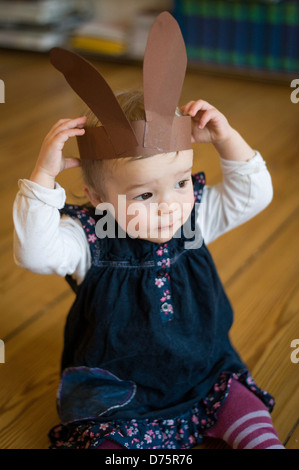 Berlin, Germany, 18 months old girl with rabbit ears Stock Photo