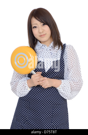 Young lady holding a frying pan Stock Photo - Alamy