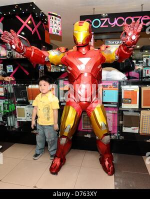 Surabaya, Indonesia. April 28, 2013. A replica of the American super hero, Iron Man, in action to entertain visitors Plaza Marina, gadgets and electronics shopping center in Surabaya. Iron Man 3 is booming in Indonesia, almost in every show, hundreds of spectators specially children lining up to watch the film. (Photo by Robertus Pudyanto/AFLO/Alamy Live News) Stock Photo