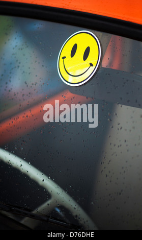 Smiley face sticker on a Volkswagen Beetle windscreen Stock Photo