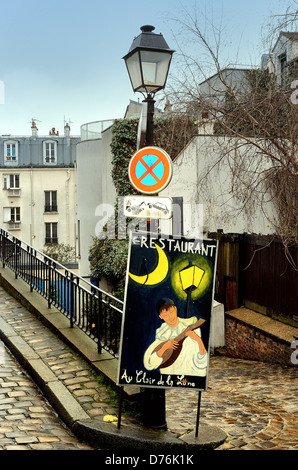 Street board for Au Clair de la Lune Restaurant in Montmartre Paris Stock Photo