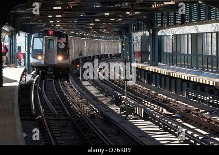 A subway train pulls into the West 8th Street station in Coney Island, Brooklyn, New York City. Stock Photo