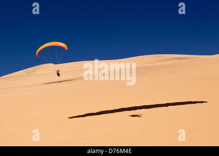 Paragliding over Dunes of Namib Desert, Long Beach, Swakopmund, Namibia Stock Photo
