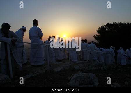 April 30, 2013 - Nablus, West Bank, Palestinian Territory - Members of the ancient Samaritan community attend the pilgrimage for the holy day of Passover at the religion's holiest site on the top of Mount Gerizim near the West Bank town of Nablus, early Tuesday, April 30, 2013. According to tradition, the Samaritans are descendants of Jews who were not deported when the Assyrians conquered Israel in the 8th century B.C. Of the small community of close to 700 people, half live in a village at Mount Gerizim, and the rest in the city of Holon near Tel Aviv  (Credit Image: © Nedal Eshtayah/APA Ima Stock Photo