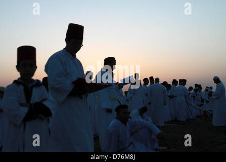 April 30, 2013 - Nablus, West Bank, Palestinian Territory - Members of the ancient Samaritan community attend the pilgrimage for the holy day of Passover at the religion's holiest site on the top of Mount Gerizim near the West Bank town of Nablus, early Tuesday, April 30, 2013. According to tradition, the Samaritans are descendants of Jews who were not deported when the Assyrians conquered Israel in the 8th century B.C. Of the small community of close to 700 people, half live in a village at Mount Gerizim, and the rest in the city of Holon near Tel Aviv  (Credit Image: © Nedal Eshtayah/APA Ima Stock Photo