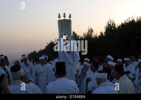 April 30, 2013 - Nablus, West Bank, Palestinian Territory - Members of the ancient Samaritan community attend the pilgrimage for the holy day of Passover at the religion's holiest site on the top of Mount Gerizim near the West Bank town of Nablus, early Tuesday, April 30, 2013. According to tradition, the Samaritans are descendants of Jews who were not deported when the Assyrians conquered Israel in the 8th century B.C. Of the small community of close to 700 people, half live in a village at Mount Gerizim, and the rest in the city of Holon near Tel Aviv  (Credit Image: © Nedal Eshtayah/APA Ima Stock Photo