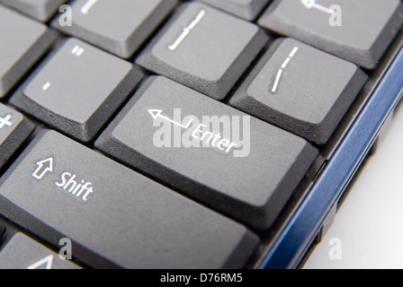closeup of blue notebook keyboard focus mainly on shift and enter keys Stock Photo