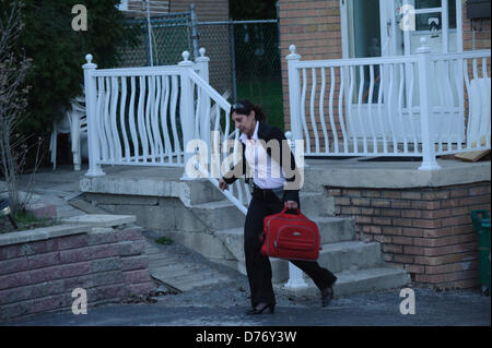 TORONTO, CA., 22 Apr 2013 - A RCMP officer leaves the home of one of the VIA Rail terrorism plot suspects. RCMP and Toronto Police searched the Cherokee Blvd. home of terrorism suspect Raed Jaser.  Royal Canadian Mounted Police have announced the arrest to two men from Toronto and Montreal that were engaged in an  Al-Qaeda supported plot to derail a VIA Rail passenger train. Stock Photo