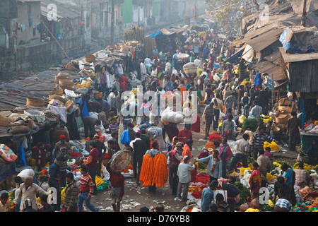 Colorful flower market at Mullick ghat near Howrah Bridge in Kolkata, India. Stock Photo