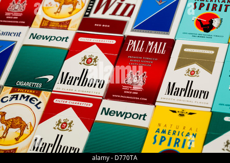 Various packs of cigarettes. Marlboro, Pall Mall, Winston, Camel, Parliament, Newport, American Spirit.  Stock Photo