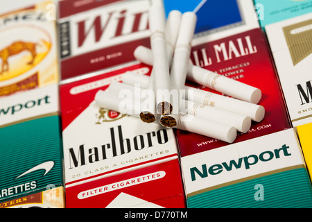 Various packs of cigarettes. Marlboro, Pall Mall, Winston, Camel, Parliament, Newport, American Spirit.  Stock Photo
