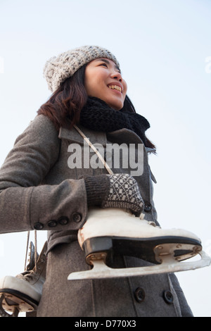 Young woman ice skating portrait, Beijing Stock Photo