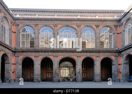 Naples. Italy. View of the inner courtyard replete with arches of the Palazzo Reale or Royal palace. The Palazzo is situated on Stock Photo