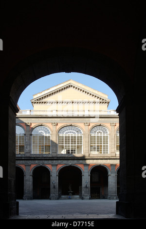 Naples. Italy. View of the inner courtyard replete with arches of the Palazzo Reale or Royal palace. The Palazzo is situated on Stock Photo