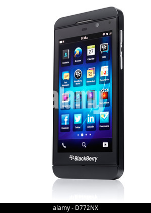 Blackberry Z10 smartphone standing at an angle. Black phone isolated on white background with clipping path Stock Photo