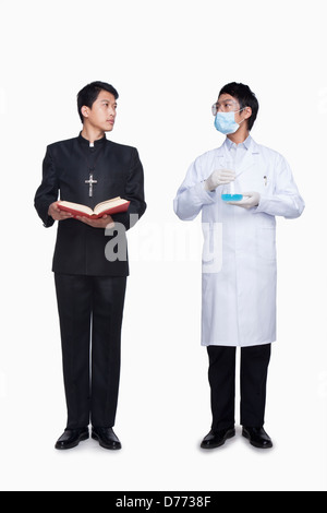 Priest and scientist Stock Photo